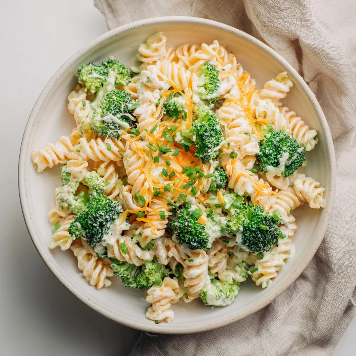 A creamy, one-pot Green Goddess Broccoli Cheddar Pasta with fresh herbs and beautifully melted cheese.