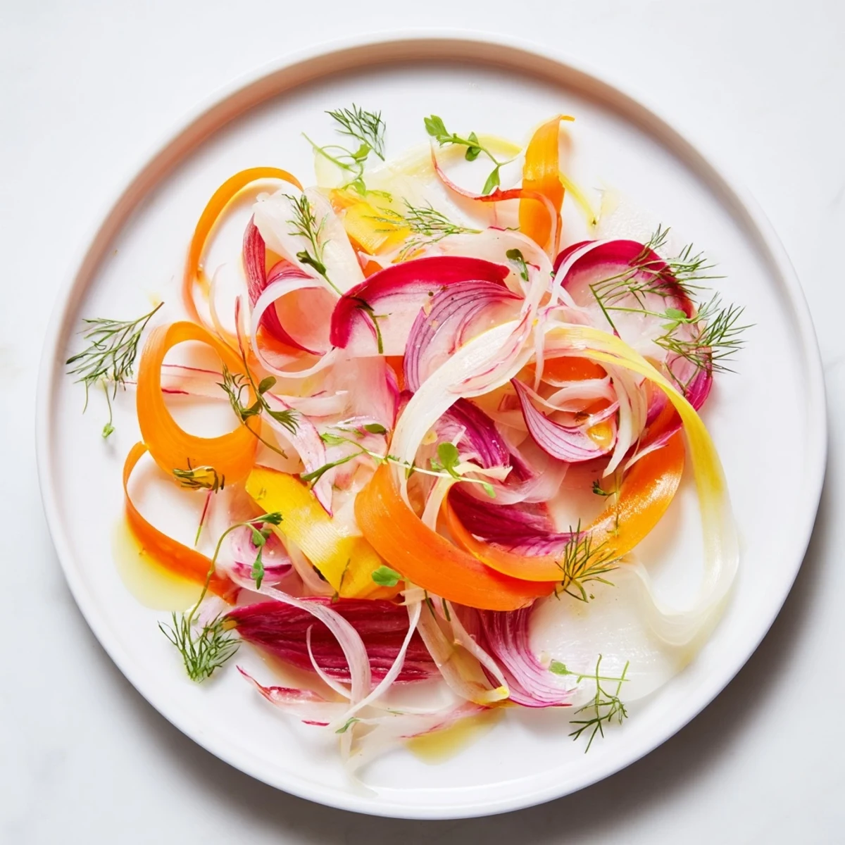 Visually stunning The Spinning Top salad features delicate, overlapping vegetable ribbons with fresh herbs.