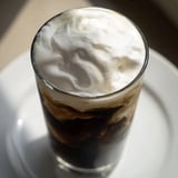 Homemade Starbucks cold foam, a creamy white topping, is perfectly textured and easily spooned.