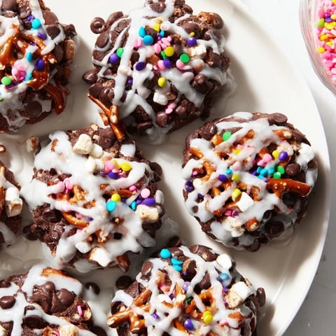 Fluffy Chaos Chocolate Cake Bites covered in colorful sprinkles, ready for the next delicious bite.