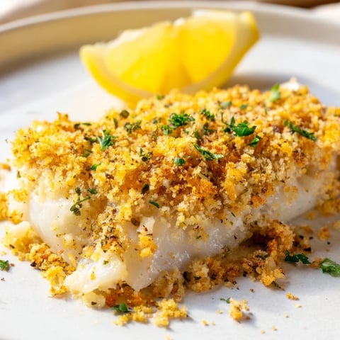 Baked Cod with Crispy Ritz Cracker Topping, golden brown and flaky, ready to be served hot.