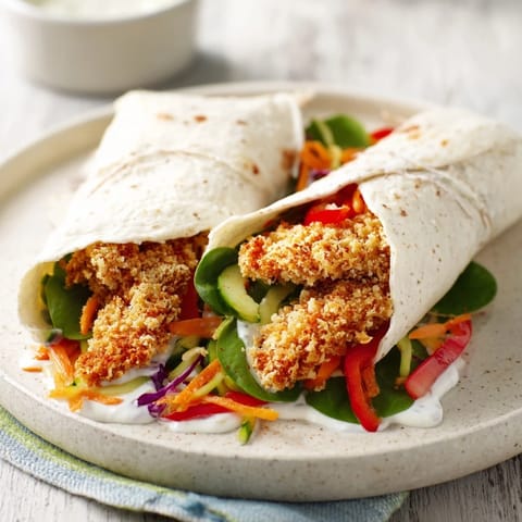 Warm wraps filled with chicken, veggies, and Candy Cane Crunch, ready to enjoy this delightful meal.