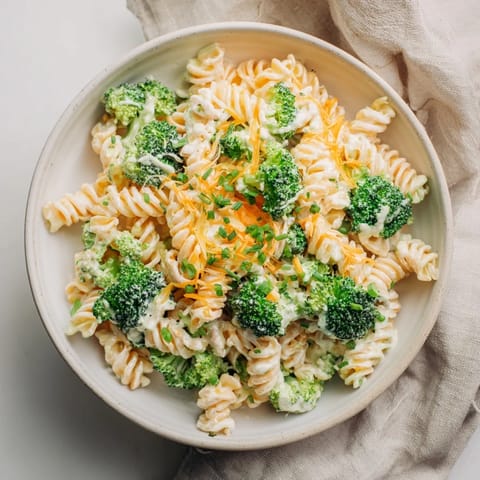 A creamy, one-pot Green Goddess Broccoli Cheddar Pasta with fresh herbs and beautifully melted cheese.