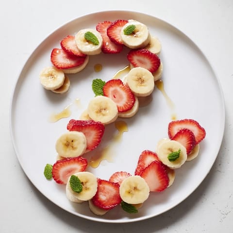 Vibrant red and white banana strawberry candy cane, ideal for a quick and healthy treat.