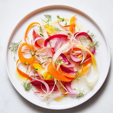 Visually stunning The Spinning Top salad features delicate, overlapping vegetable ribbons with fresh herbs.