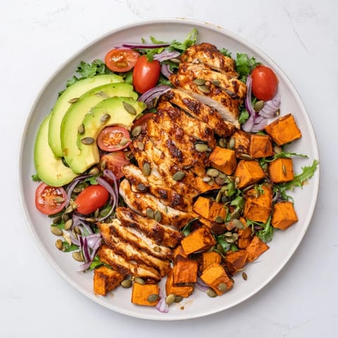 Golden roasted sweet potatoes and creamy avocado complete this healthy Avocado and Sweet Potato Chicken Bowl.