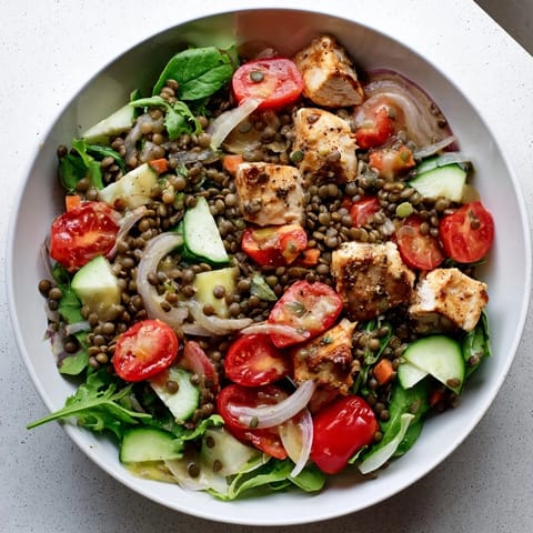 Earthy lentils and tender chicken combine in a vibrant Chicken and Lentil Recession Salad, perfect for chilling.
