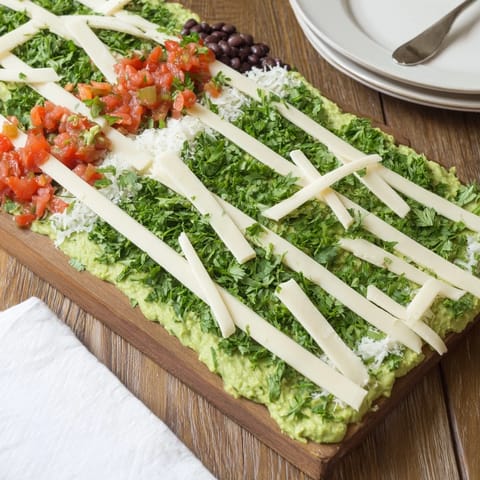 This delicious Game Day Football Field Snack Board presents a festive array of dips, chips, and dippers for game day.
