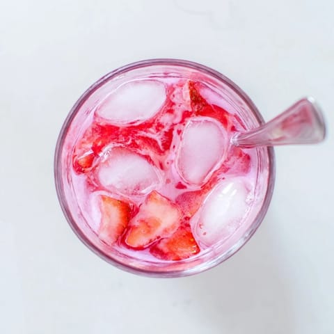 Creamy Refresher Copycat Pink Drink made with coconut milk and strawberry syrup for a tropical sip.