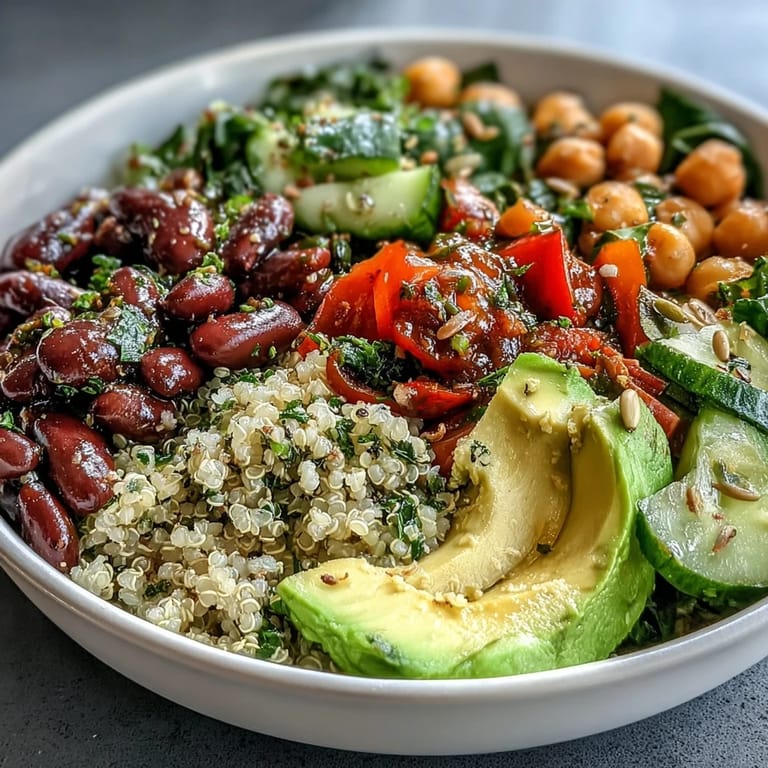 This protein-packed Three-Bean Power Bowl features chickpeas, black beans, and a zesty vinaigrette for a healthy lunch.