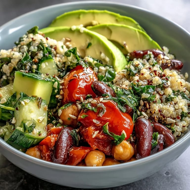 Hearty Three-Bean Power Bowl with crunchy cucumbers, cherry tomatoes, and toasted seeds, ready for a nourishing dinner.