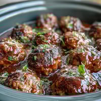 1. Slow cooker meatballs in rich tomato sauce, tender and juicy, served warm for a crowd-pleasing appetizer or main dish.  