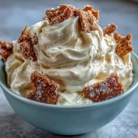 Viral 3-Ingredient Cheesecake Dip with Graham Crackers in a bowl, topped with fresh berries and served with crunchy graham crackers for dipping.  